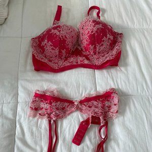 A romantic bra top features floral lace, a lace-up front and a Floral Lace  Belt